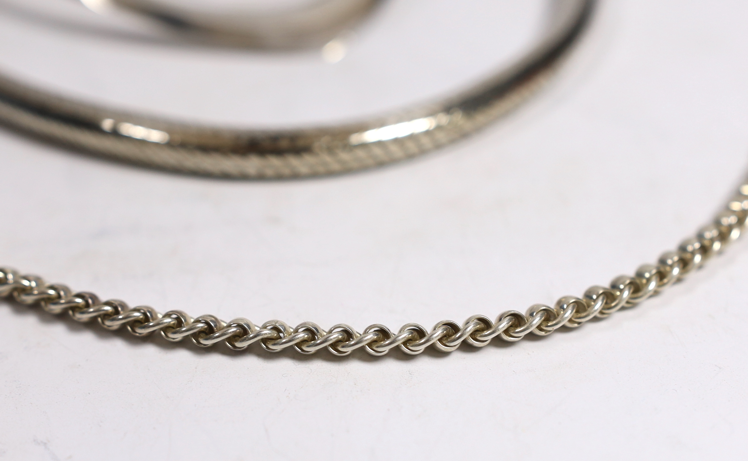 A large continental white metal snake link necklace, 44cm, a silver chain, a silver crossover bracelet and a 925 necklet.